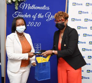 DSC_9090 - JN Bank Audrey Williams (right), chief, treasury and investments, JN Bank, presents Kelly Kellier Anderson, Maths Teacher of the Year, with a plaque and a gift certificate, courtesy of JN Bank.