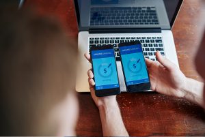 African American Man Using Smartphone And Credit Card At Home - JN Bank