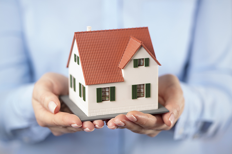 small-toy-house-in-hands-22WJDF3 - JN Bank