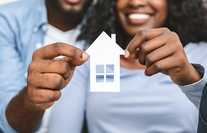 close-up-of-african-couple-holding-wooden-house-2021-08-26-16-34-00-utc-min - JN Bank