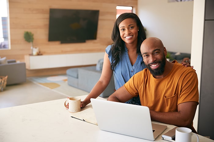portrait-of-african-american-couple-using-laptop-t-2021-08-28-20-17-26-utc-min - JN Bank