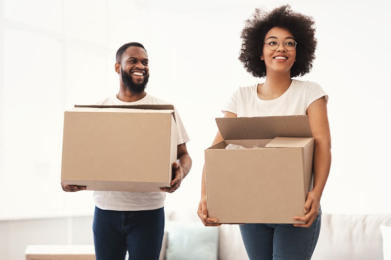 african-american-spouses-carrying-moving-boxes-int-2021-09-02-04-35-26-utc-min - JN Bank