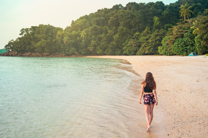 woman-walking-on-sand-shore-near-water-2022-03-04-06-20-15-utc (1) - JN Bank