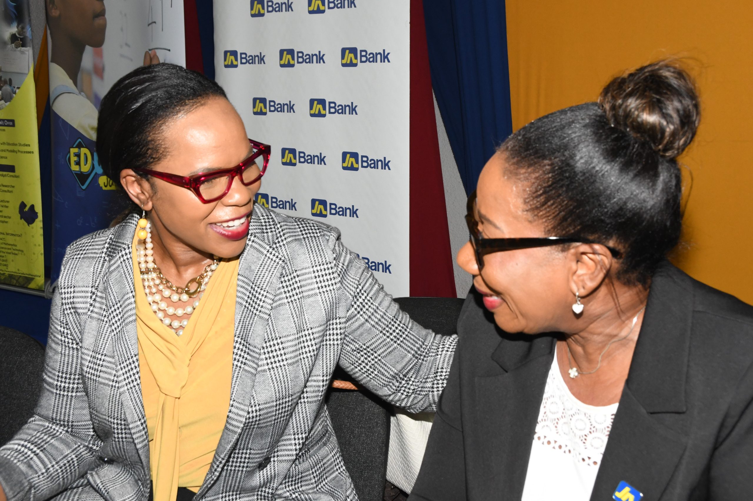 DSC_0456 - JN Bank : Sandra Jones (right), Manager for Public Sector Engagement at JN Bank shares a light moment with Dr Kasan Troupe, Permanent Secretary in the Ministry of Education and Youth