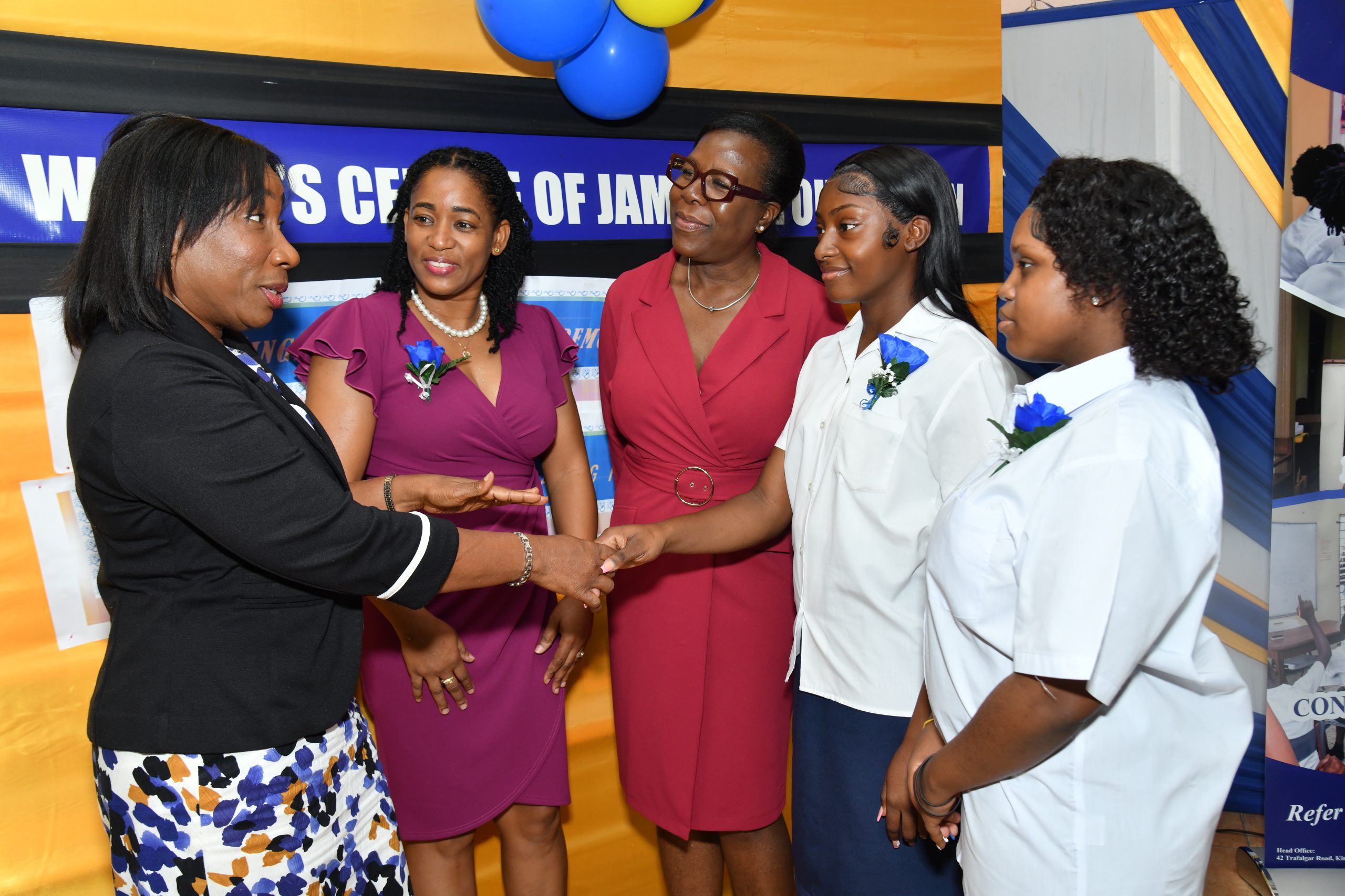 Women's Centre Graduation NTP_9942 - JN Bank Sandra Jones (left), Manager, Public Sector Engagement, JN Bank, congratulates Nyalia Cookkorne (second right) and Treshanna Thompson (right) on their outstanding academic performance. The occasion was the graduation ceremony for 13 adolescent mothers at the Women’s Centre of Jamaica in St Andrew on July 2. Sharing in the special moment are Marlene Murray-Brown, Acting Centre Manager and Counsellor, WCJF; and Novlette Howell, Executive Director, WCJF.