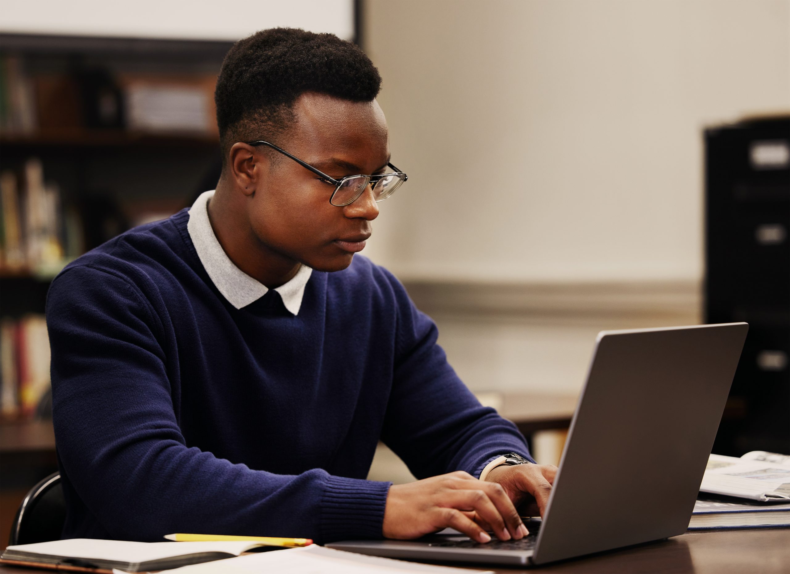 student-learning-and-black-man-typing-on-a-laptop-2026-01-09-10-07-25-utc - JN Bank